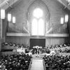[C. Warren Becker plays the organ at a dedication service at Pioneer Memorial Church]