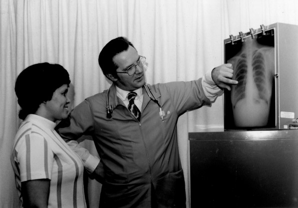 [K. Robert Lang consulting Grace Thorpe, a new part-time physician at Andrews University Medical Center]