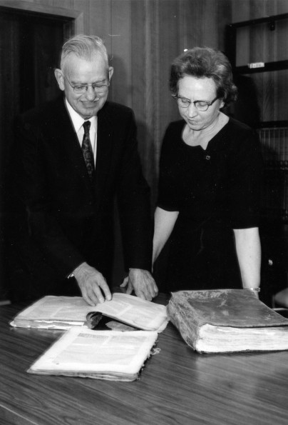 [Mary Jane Mitchell accepting portions of rare early printed Hebrew Bibles from Edwin Thiele on behalf of the James White Library]