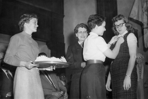 [Pinning on corsages after ingathering]