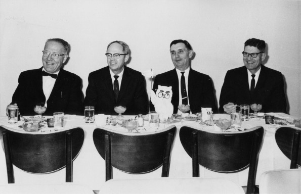 [University and community leaders sitting at the fundraising dinner for the new AU elementary school]
