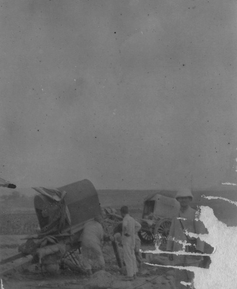 Chinese cart wheel repaired while a westerner waits