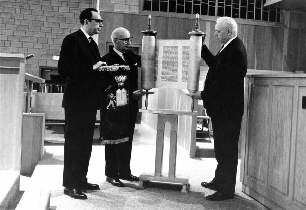 [W.G.C. Murdoch accepting a Hebrew Torah scroll from George Suhrie on behalf of the James White Library]