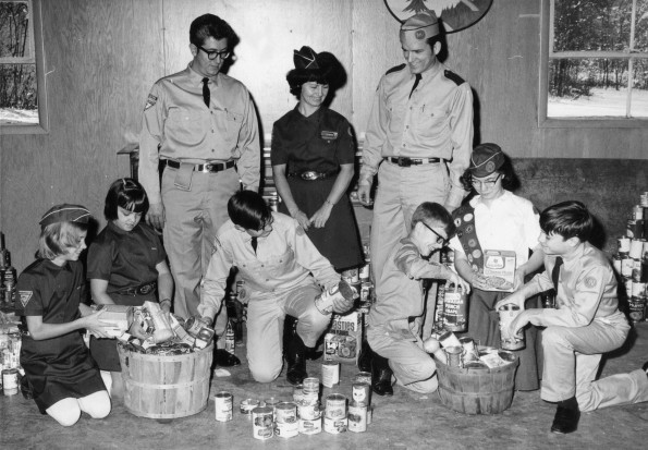 [Pathfinders from Berrien Springs, Michigan organizing food gathered during the annual Thanksgiving food drive]