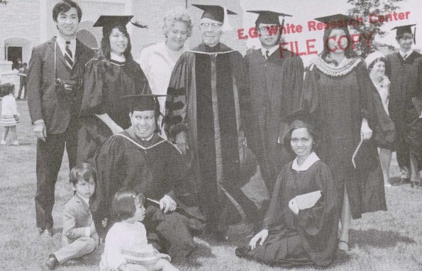[Harry Willis Miller and his wife with students from the Far East]