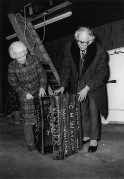 [Horace Shaw examining a trunk that belonged to Charles H. Watson]
