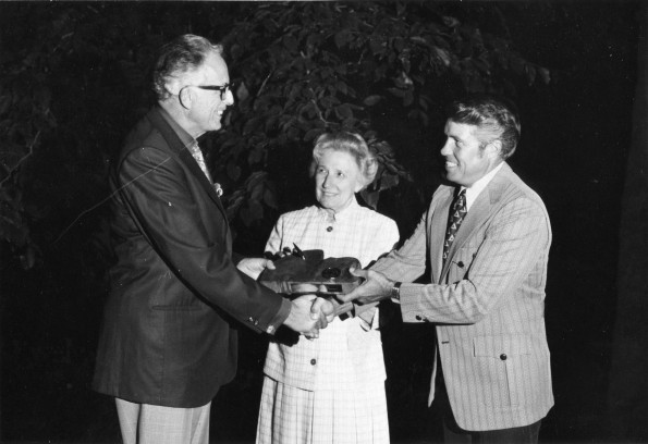 Horace Shaw, from the Andrews University Alumni Association, gives a gift to Donald G. Prior, Andrews University vice-president