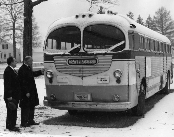 [Anthony Castelbuono and V. E. Garber looking at the Pathfinder bus]