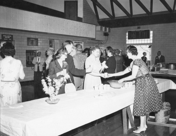 Refreshment table in Johnson Gymnasium prior to the Andrews University alumni Homecoming banquet, 1960