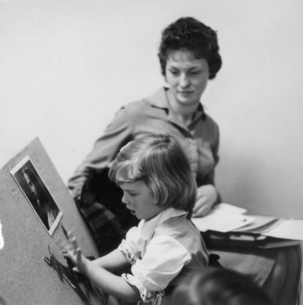 [Kindergarten student playing with felts in Sabbath School at Pioneer Memorial Church]