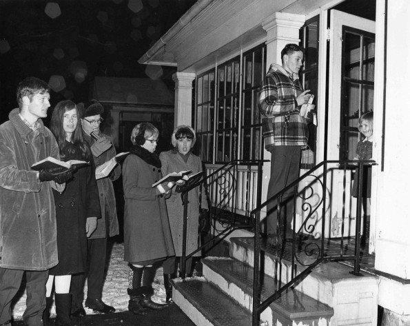 [Students and faculty caroling at the annual Ingathering Up-lift]