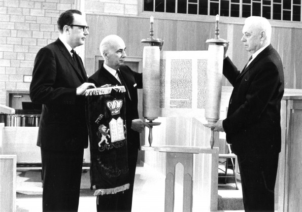 [W.G.C. Murdoch accepting a Hebrew Torah scroll from George Suhrie on behalf of the James White Library]