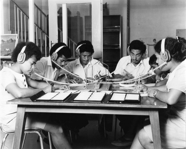 Fulton College students listening to audio cassette material in the school library