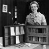 [Mary Jane Mitchell standing with John Andrews' Literature Case that was donated to the James White Library]