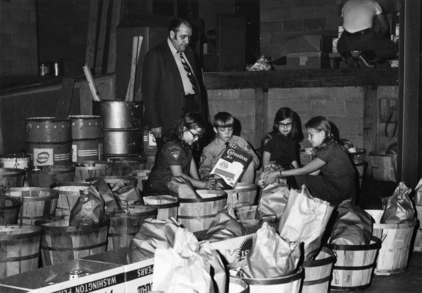 [Pathfinders of Berrien Springs, Michigan organizing food gathered during the annual Thanksgiving food drive]