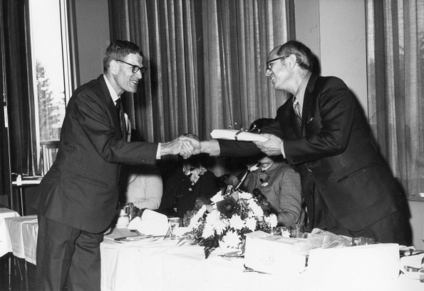 [Wilson L. Trickett shaking hands with Richard Hammill during Andrews University's 1971 alumni homecoming]