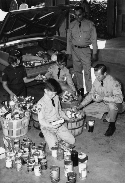 [Pathfinders from Berrien Springs, Michigan organizing food collected during the annual Thanksgiving food drive]
