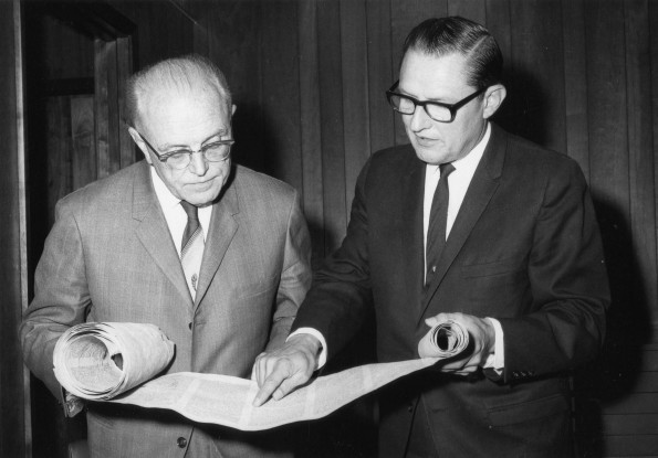 [Siegfried Horn and Steven Vitrano examine a scroll]