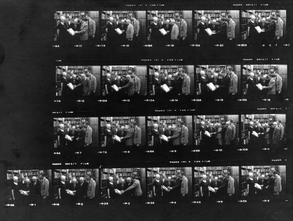 [Arthur L. White showing Ellen G. White letters to White Estate staff and visitors in the Ellen G. White Estate Branch Office in the Andrews University James White Library]