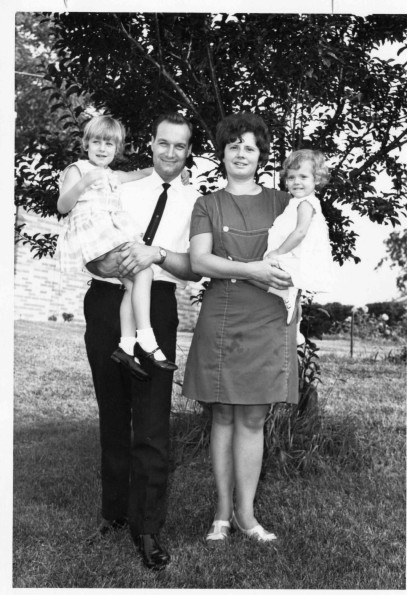 Mr. and Mrs. Roger Peden with their young girls