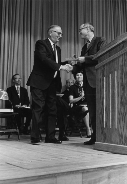 [Emmett K. Vande Vere receives an award from Andrews University president Richard Hammill]