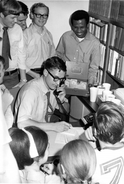 [Everett Schlisner calls in fundraising results to the 'Voice of Prophecy' radio station]