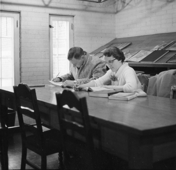 [Students studying in Emmanuel Missionary College library]