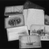 [Pictures and log books related to Pitcairn Island displayed in the Andrews University Heritage Room]