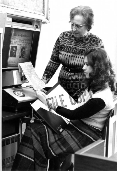 [Mary Jane Mitchell demonstrating the new microfilm reader-printer in the James White Library]
