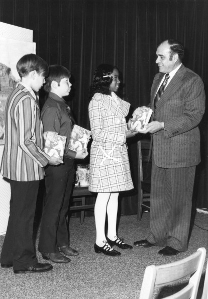 [Youth receiving attendance awards from Anthony Castelbuono]