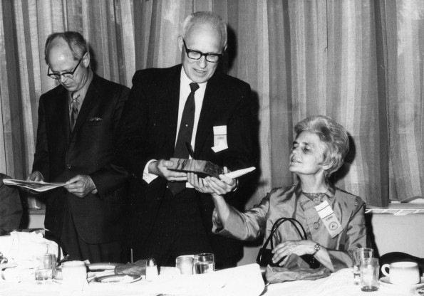 [James Hagle and his wife examining a gift during Andrews University's 1971 alumni homecoming]