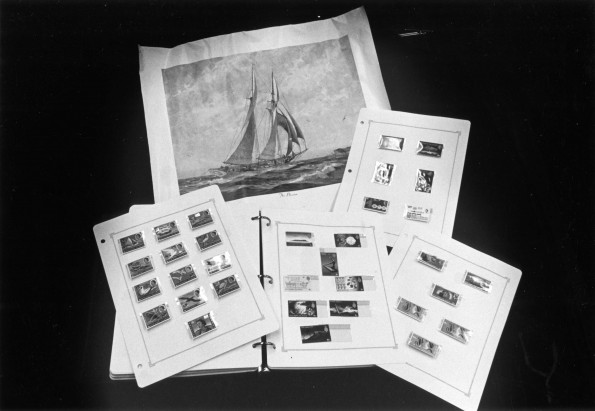 [Colorful stamps portraying the life on Pitcairn Island displayed in the Andrews Univeristy Heritage Room]