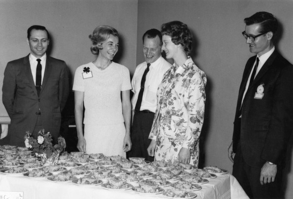 Alumni of Andrews University having fun with desert at Homecoming dinner