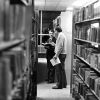 [Andrew Levay and friend in James White Library stacks]