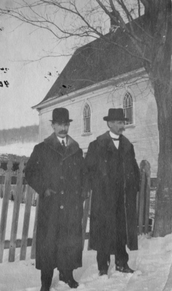 [Malcolm N. Campbell and W. Jay Tanner in front of the Fitch Bay Seventh-day Adventist Church]