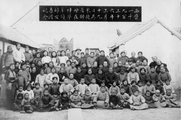 Missionary couple with a group of Chinese people who studied the Bible under the direction of Mrs. Mi Chun Zhen