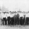 [Group of Seventh-day Adventist men setting up for a camp meeting]