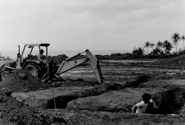 [Don Myers standing by antenna section]