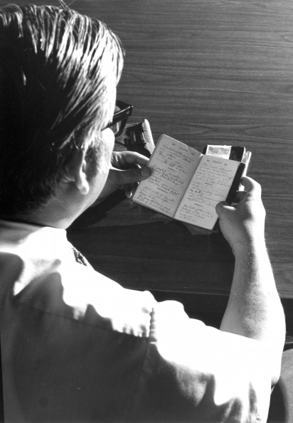 [Sakae Kubo reading the diary of John F. Byington in the Andrews University Heritage Room]