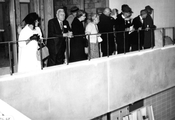 Visiting alumni at Homecoming Weekend have a look at the new swimming pool