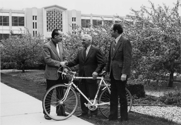 [Edward Nachreiner with the bicycle presented to him in recognition of 37 years of service]