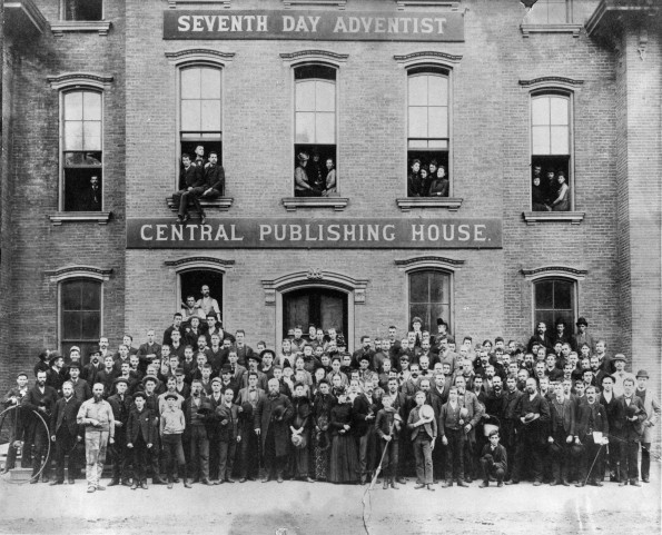 [Seventh-day Adventist Central Publishing House staff pose in front of their building]