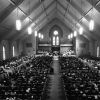 [C. Warren Becker plays the organ at a dedication service at Pioneer Memorial Church]