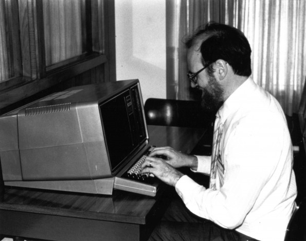 [Harvey Brenneise working on a computer in the James White Library]