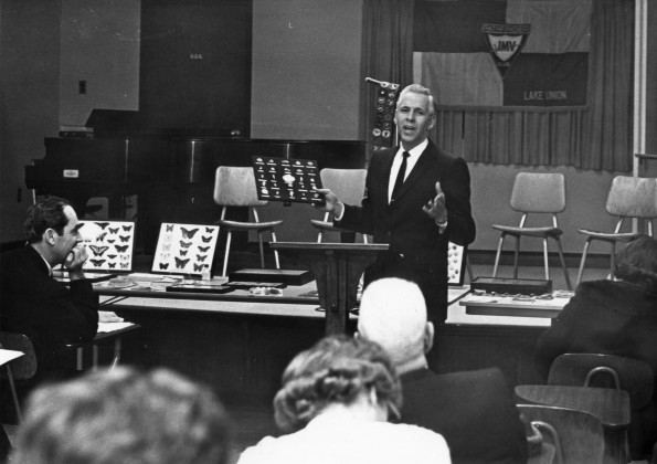 [Merrill Fleming displays his hobby collections during the Pathfinder officers training course held at Andrews University]