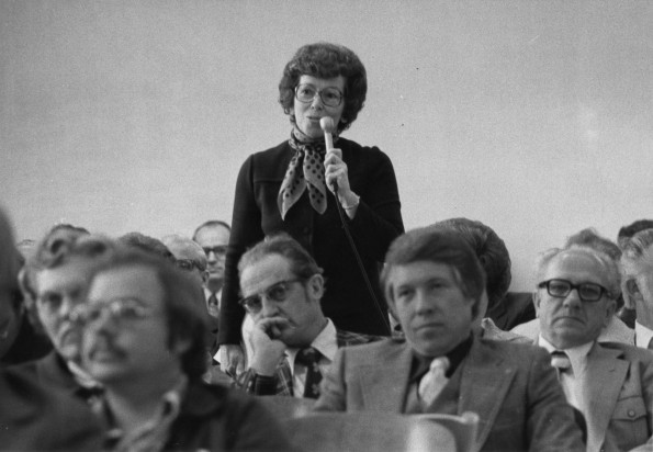 [Elsie Buck speaks at a meeting]