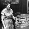 [Louise Dederen observing William Miller's hatbox in the Heritage Room in the James White Library]
