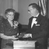 [Bernard V. Bowen presents a plaque to an unknown woman]