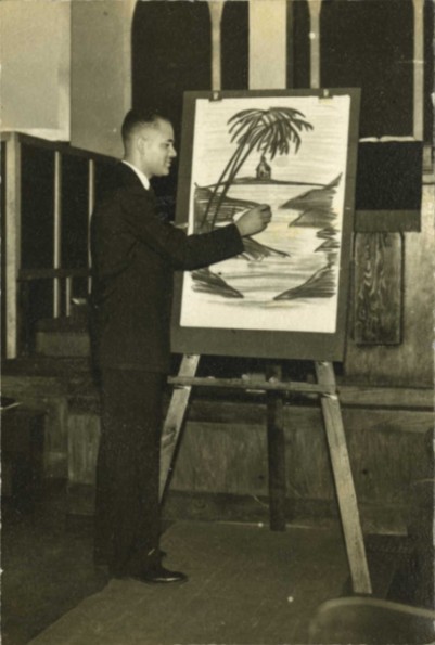 [Louis B. Reynolds doing chalk art]