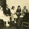 [Charles M. Kinney talking with a group of people associated with the Riverside Sanitarium]